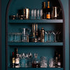 Large shelves in Juliska Teal showcase the metal and glass barware collections.