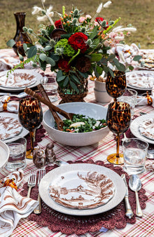 An outdoor table set in autumn tones features the Country Estate Harvest Collection.